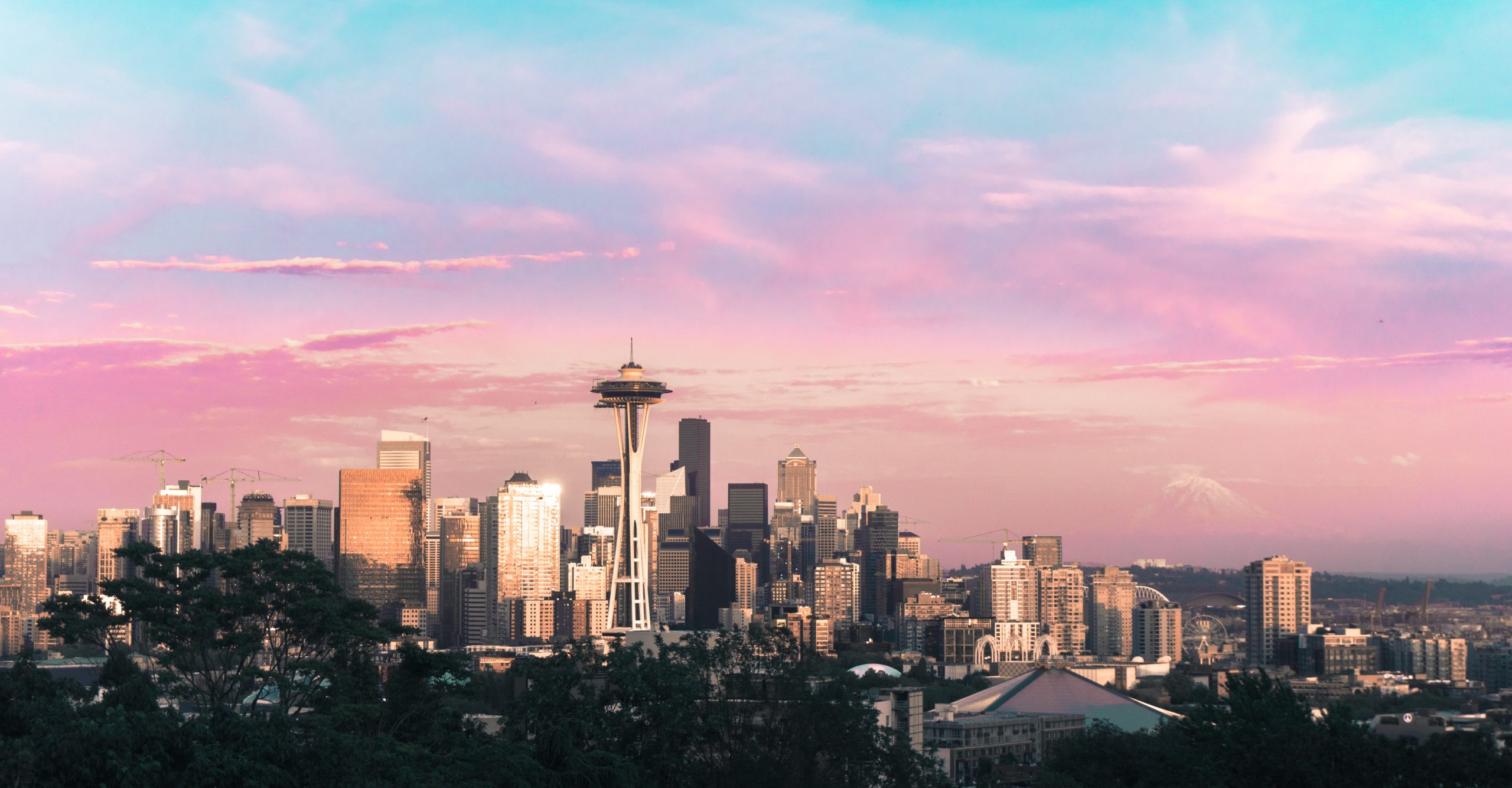 Skyline of Seattle, Washington with Denali in the background and the Space Needle in the foreground. 