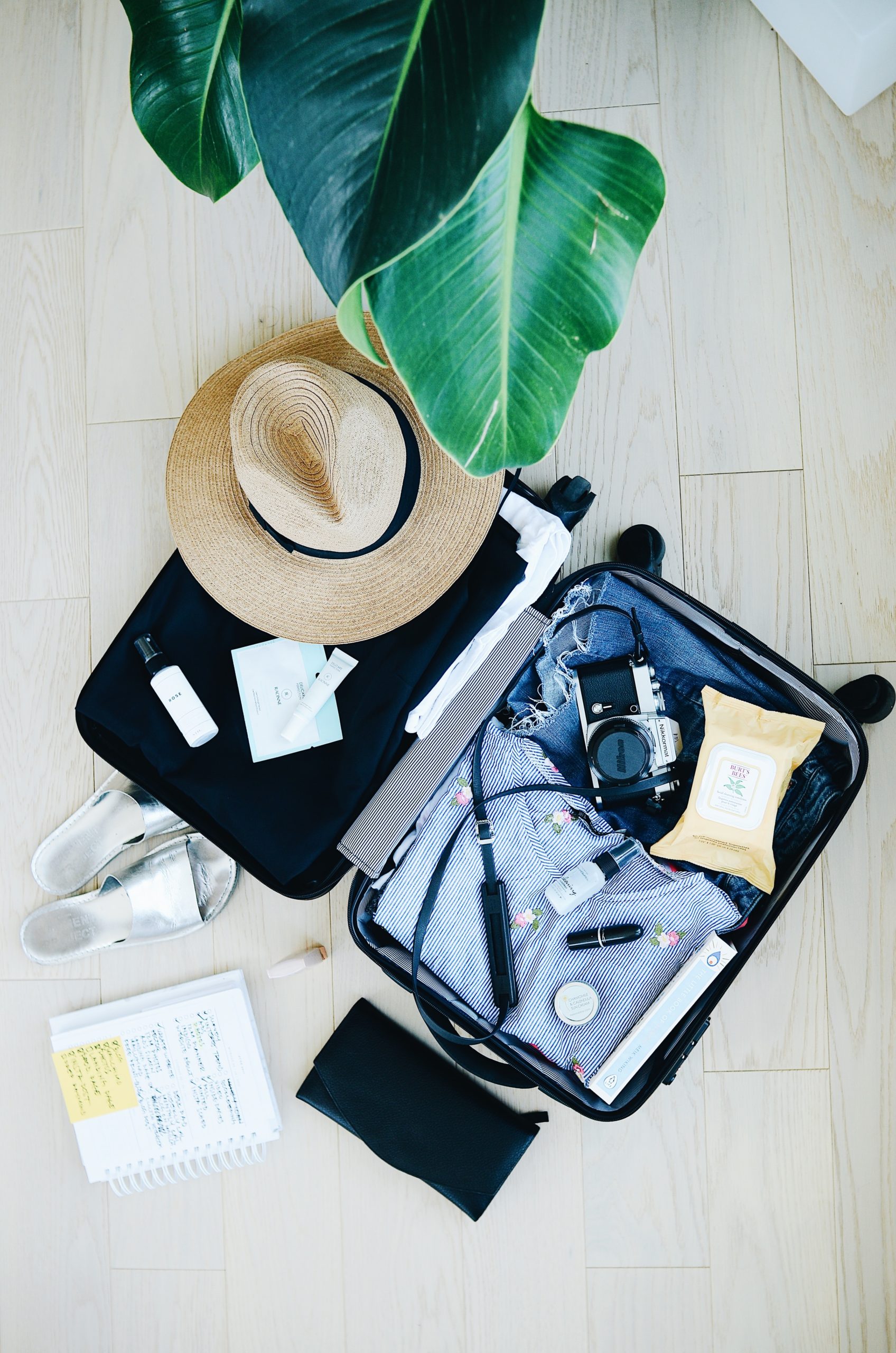 Messy suitcase that could be packed better with travel hacks. 